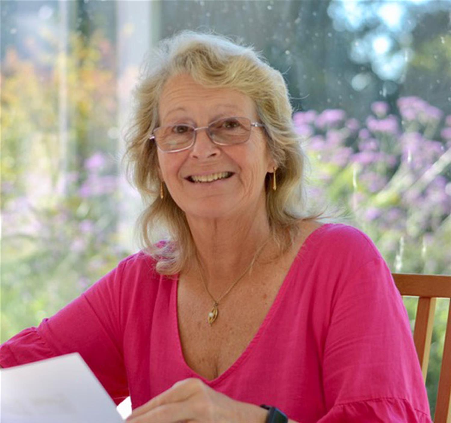 A trainer looking up from a document